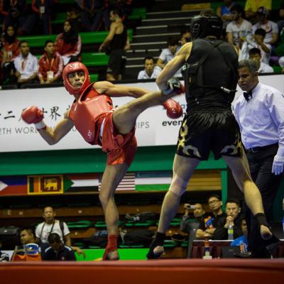 Thomas Nguyen (en rouge) pendant le Championnat du monde de Sanda 2014.