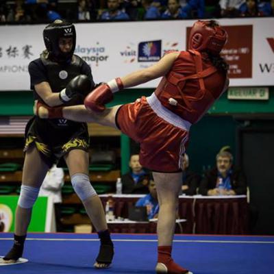 Delphine Stambouli (en rouge) au Championnat du Monde de Sanda 2014.